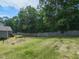 Spacious backyard surrounded by mature trees and a wooden fence at 70 King Mackeral Ct, Willow Springs, NC 27592