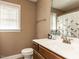 Cozy bathroom with a mirrored vanity and window with natural light at 70 King Mackeral Ct, Willow Springs, NC 27592