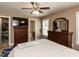 Comfortable bedroom featuring a ceiling fan and plenty of closet space at 70 King Mackeral Ct, Willow Springs, NC 27592