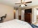 Comfortable bedroom featuring a ceiling fan, television, and exercise equipment at 70 King Mackeral Ct, Willow Springs, NC 27592