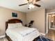 Comfortable bedroom features a ceiling fan, a painting, and a bike at 70 King Mackeral Ct, Willow Springs, NC 27592