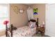 Whimsical bedroom featuring a twin bed with butterfly bedding, bedside table, and decorative accents at 70 King Mackeral Ct, Willow Springs, NC 27592