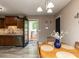 Cozy dining area with a view to the outside deck and a kitchen area at 70 King Mackeral Ct, Willow Springs, NC 27592