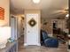 Inviting hallway leading to the living area, showcasing wood-look floors and neutral walls at 70 King Mackeral Ct, Willow Springs, NC 27592