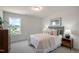 Comfortable bedroom features a large window with a view and nightstands with lamps for convenience at 702 Beacon Hill Rd # 51, Lillington, NC 27546
