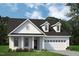 Charming new construction home featuring a welcoming two-car garage and manicured lawn at 702 Beacon Hill Rd # 51, Lillington, NC 27546
