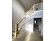 Spacious foyer featuring a staircase with white banisters and natural wood accents, awaiting final touches at 7491 Sweetwater Dr, Nashville, NC 27856