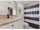 Bathroom features a white vanity, granite countertop, and ample storage, creating a refreshing space at 7804 Tylerton Dr, Raleigh, NC 27613
