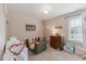 Cozy and well-lit bedroom features a colorful décor, soft carpet, and plenty of room to play at 7804 Tylerton Dr, Raleigh, NC 27613