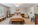 Cozy bedroom featuring neutral walls, natural light, and decorative accents at 7804 Tylerton Dr, Raleigh, NC 27613