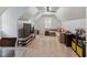 Spacious finished attic bedroom with light decor, plush couches and carpet, and a large TV at 7804 Tylerton Dr, Raleigh, NC 27613