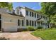 Charming two-story home with white siding, black shutters, attached garage, and well-manicured lawn at 7804 Tylerton Dr, Raleigh, NC 27613