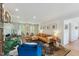 Spacious living room with a beautiful rug, hardwood floors, cozy seating, and lots of natural light at 7804 Tylerton Dr, Raleigh, NC 27613