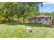Spacious backyard with lawn and privacy fence at 827 Loop Rd Rd, Burlington, NC 27217