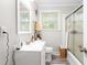 Clean, well-lit bathroom featuring a white vanity, tiled shower, and modern fixtures at 827 Loop Rd Rd, Burlington, NC 27217