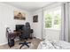 Neutral bedroom featuring a desk, gaming chair, and a large window at 827 Loop Rd Rd, Burlington, NC 27217