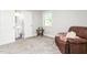 Bedroom featuring a private ensuite bathroom and a comfortable chair at 827 Loop Rd Rd, Burlington, NC 27217