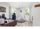 Bright bedroom with a gaming chair, bean bag, and two windows at 827 Loop Rd Rd, Burlington, NC 27217
