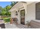 Charming front porch featuring stylish decor and seating area at 827 Loop Rd Rd, Burlington, NC 27217
