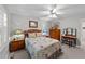 Carpeted bedroom offers a ceiling fan, matching dressers and comfortable bed with quilting at 8513 Applecross Cir, Apex, NC 27539