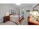 Traditional bedroom with matching dressers, hardwood bedframe and quilted bedding at 8513 Applecross Cir, Apex, NC 27539