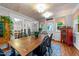 Bright dining room with hardwood floors, beamed ceilings, and natural light at 8513 Applecross Cir, Apex, NC 27539