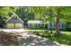 Charming home featuring a large front yard, blue siding, a detached garage, and a long driveway at 8513 Applecross Cir, Apex, NC 27539