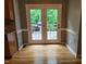 Sunlit breakfast nook with hardwood floors and deck access at 9009 Miranda Dr, Raleigh, NC 27617