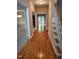 Inviting foyer boasts gleaming hardwood floors and a staircase leading to the upper level at 9009 Miranda Dr, Raleigh, NC 27617