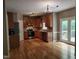 Well-equipped kitchen features wood cabinets, granite countertops, and stainless steel appliances at 9009 Miranda Dr, Raleigh, NC 27617