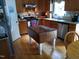 Cozy kitchen featuring hardwood floors, wood cabinets, stainless steel appliances and plenty of counter space at 9009 Miranda Dr, Raleigh, NC 27617