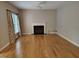 Spacious living room with hardwood floors and fireplace at 9009 Miranda Dr, Raleigh, NC 27617