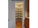 Spacious walk-in pantry with ample shelving for organized storage and easy access at 9009 Miranda Dr, Raleigh, NC 27617