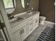 Bathroom vanity with dual sinks, white counters and chrome hardware at 9009 Miranda Dr, Raleigh, NC 27617