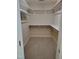 Carpeted walk-in closet with shelving and hanging racks at 9009 Miranda Dr, Raleigh, NC 27617