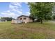 The backyard includes a utility shed, mature trees, and a well-maintained lawn at 1012 Roxboro St, Haw River, NC 27258