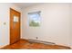 Bedroom featuring a window, closet and a wood floor at 1012 Roxboro St, Haw River, NC 27258