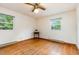 Bedroom with windows offering natural light and hardwood floors at 1012 Roxboro St, Haw River, NC 27258