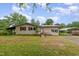 Charming single-story home with a covered parking area and a well-maintained front yard at 1012 Roxboro St, Haw River, NC 27258