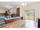 Multilevel living space showing hardwood flooring and light blue carpet in the adjacent room at 1012 Roxboro St, Haw River, NC 27258