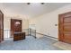 A loft space featuring light blue carpet, railing, and a view of a living space below at 1012 Roxboro St, Haw River, NC 27258