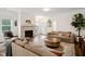 Inviting living room featuring fireplace, hardwood floors, and comfortable seating at 1211 Gloriosa St, Apex, NC 27523