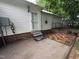A back patio includes a door to the house and a brick surround, creating an inviting outdoor space at 1312 High Ridge Dr, Mebane, NC 27302
