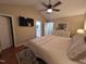 Large bedroom boasts a cozy bed, a modern ceiling fan, and a mounted television for ultimate relaxation at 1312 High Ridge Dr, Mebane, NC 27302