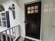 A welcoming front door offers curb appeal, with decorative lanterns, and a stylish black finish at 1312 High Ridge Dr, Mebane, NC 27302