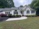 Beautiful single-story home with dark shutters and a well-manicured lawn and garden at 1312 High Ridge Dr, Mebane, NC 27302