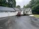 This lovely home has an attached three-car garage and a sprawling paved driveway at 1312 High Ridge Dr, Mebane, NC 27302