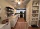 Well-lit kitchen featuring white cabinets, stainless steel appliances, and modern backsplash at 1312 High Ridge Dr, Mebane, NC 27302