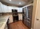 Modern kitchen with stainless steel appliances and sleek white cabinets at 1312 High Ridge Dr, Mebane, NC 27302