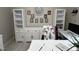 A well-lit home office featuring built-in shelving and a neutral color palette for a productive workspace at 1312 High Ridge Dr, Mebane, NC 27302